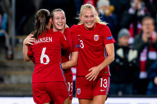 Elisabeth Terland of Norway celebrates with teammates Tuva