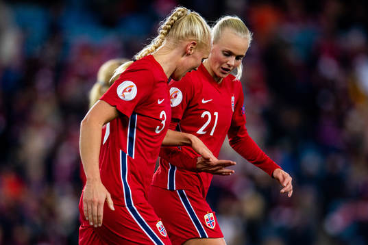 Maria Thorisdottir and Karina Sævik of Norway celebrate