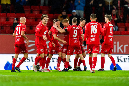 Bård Finne of Brann celebrates with team mates
