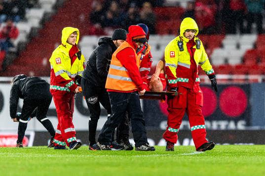Ruben Kristiansen of Brann is carried of the pitch