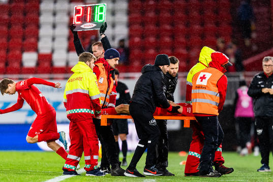 Ruben Kristiansen of Brann is carried of the pitch