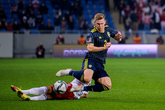 Irakli Azarov of Georgia and Emil Krafth of Sweden