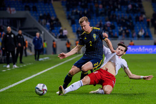 Emil Krafth of Sweden and Khvicha Kvaratskhelia of Georgia