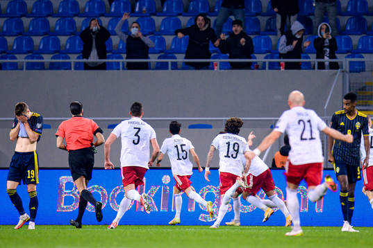 Mattias Svanberg and Alexander Isak of Sweden look dejected