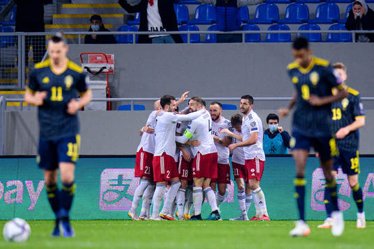 Players of Georgia celebrate the 1-0 goal by Khvicha