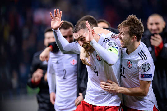 Guram Kashia and Saba Lobzhanidze of Georgia celebrate