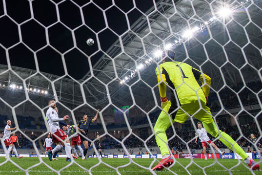 Zlatan Ibrahimovic of Sweden with a header against