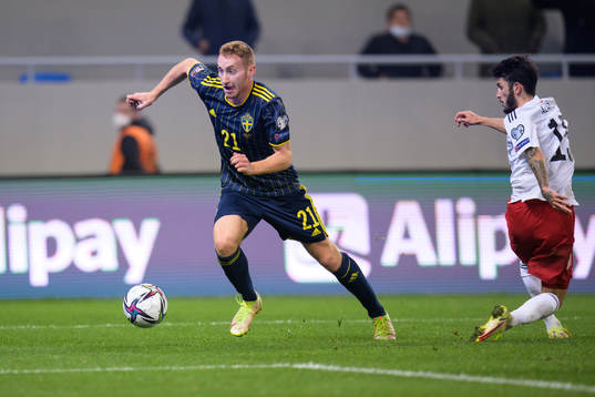 Dejan Kulusevski of Sweden and Irakli Azarov of Georgia