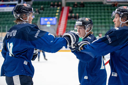 Kasper Puutio of Finland celebrates with teammates