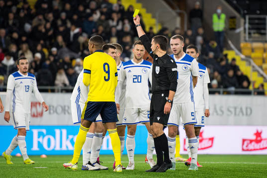 Players of Bosnia-Herzegovina reacts against Referee