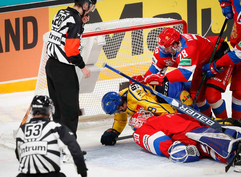 Pontus Holmberg of Sweden Daniil Vovchenko and goalie