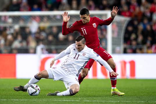 Mohamed Elyounoussi of Norway and Roberts Savalnieks of