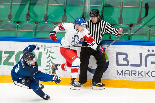Lukas Pajer of Czech Republic skates in to a referee