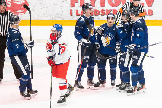 Juuso Mäenpää of Finland celebrates with teammates