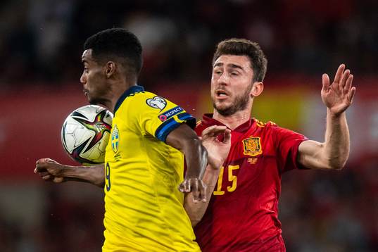 Alexander Isak of Sweden and Aymeric Laporte of Spain