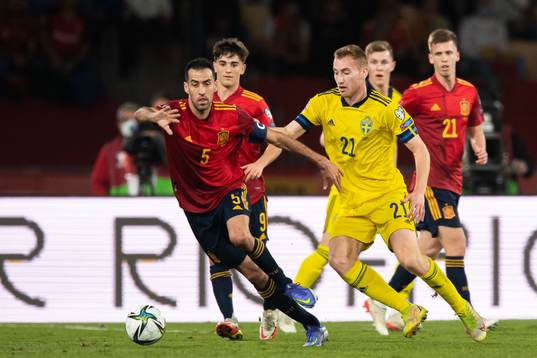 Sergio Busquets of Spain and Dejan Kulusevski of Sweden