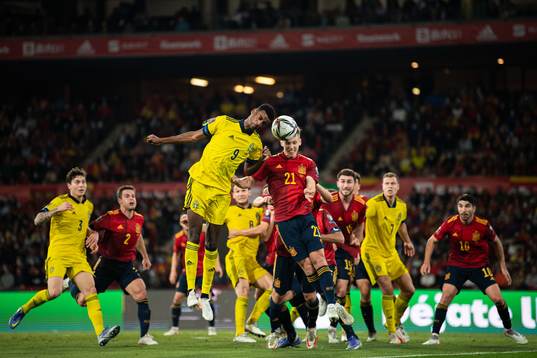 Alexander Isak of Sweden and Dani Olmo of Spain