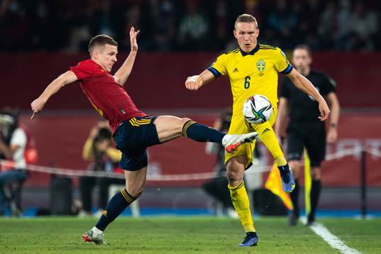 Dani Olmo of Spain and Ludwig Augustinsson of Sweden