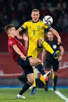 Dani Olmo of Spain and Ludwig Augustinsson of Sweden