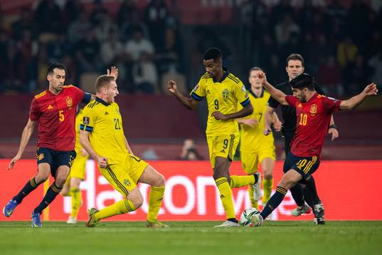 Sergio Busquets and Carlos Soler of Spain against Dejan
