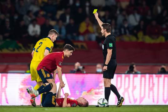 Emil Krafth of Sweden receives a warning from referee Felix