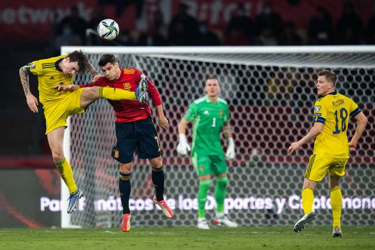 Victor Nilsson Lindelöf of Sweden and Alvaro Morata of