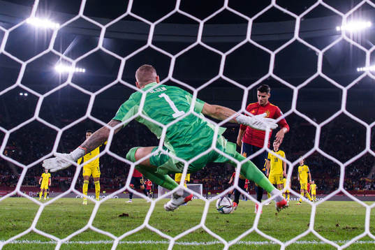 Alvaro Morata of Spain scores 1-0 behind goalkeeper Robin