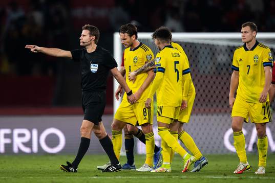 Referee Felix Brych and Albin Ekdal of Sweden
