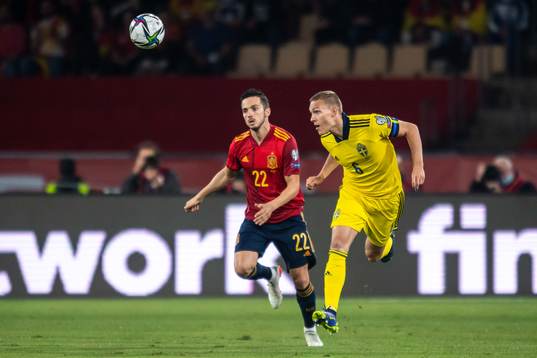 Pablo Sarabia of Spain and Ludwig Augustinsson of Sweden