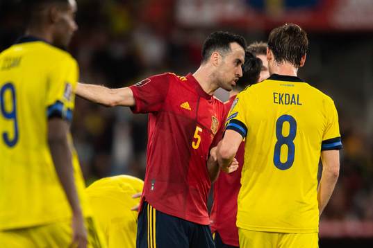 Sergio Busquets of Spain and Albin Ekdal of Sweden