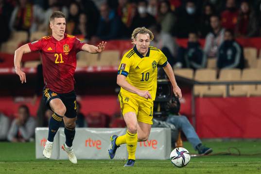 Dani Olmo of Spain and Emil Forsberg of Sweden