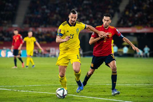 Zlatan Ibrahimovic of Sweden and Sergio Busquets of Spain