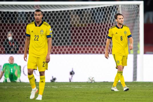 Robin Quaison and Albin Ekdal of Sweden look dejected