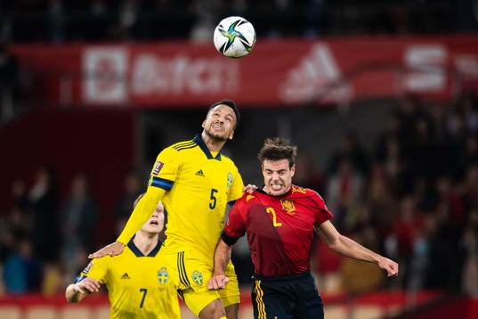 Martin Olsson of Sweden and Cesar Azpilicueta of Spain
