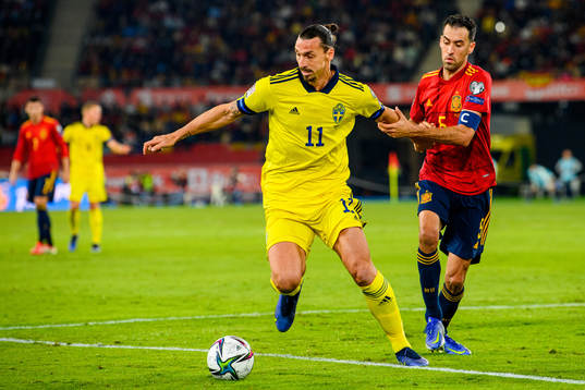Zlatan Ibrahimovic of Sweden and Sergio Busquets of Spain