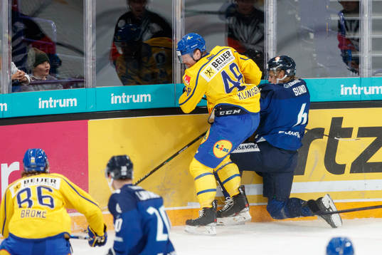 Carl Klingberg of Sweden and Tony Sund #6 of Finland