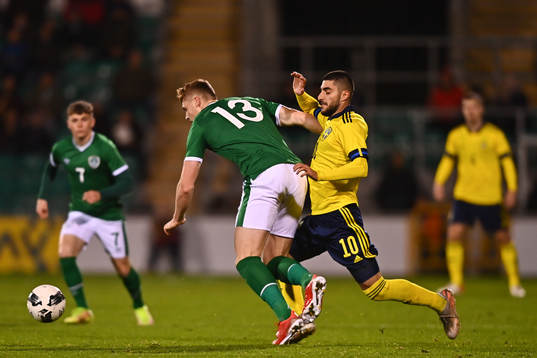 Jake O'Brien of Republic of Ireland and Rami Al Hajj of