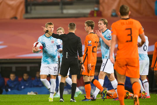 Martin Ødegaard and Wout Weghorst of Norway reacts against
