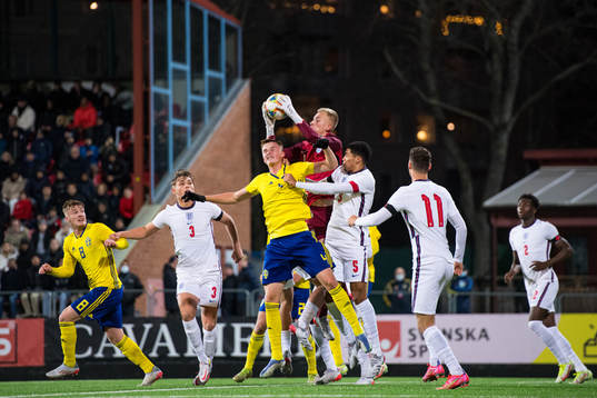 Elias Olsson of Sweden in action with goalkeeper Matthew