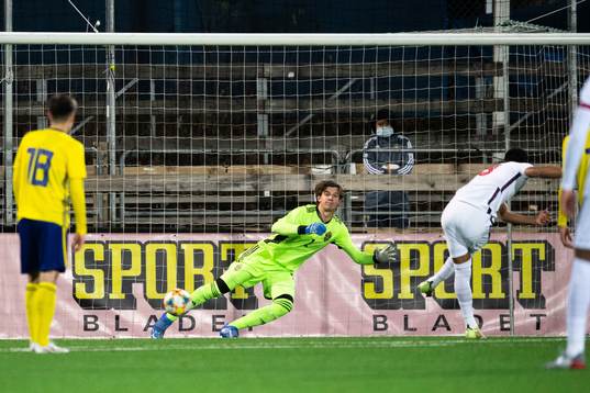 Goalkeeper Melker Ellborg of Sweden lets in a penalty kick