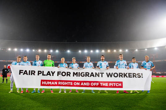 Norway's starting eleven pose for a team photo with a sign