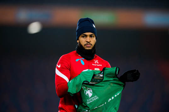 Joshua King of Norway warms up