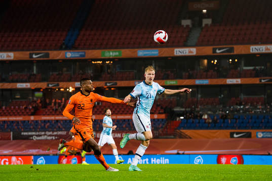 Denzel Dumfries of Netherlands and Andreas Hanche-Olsen of