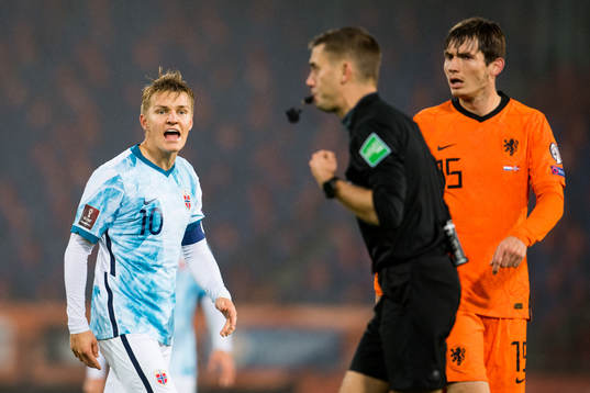 Martin Ødegaard of Norway reacts against Clément Turpin,