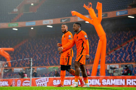 Steven Bergwijn of Netherlands celebrates with teammate