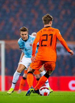 Martin Ødegaard of Norway and Frenkie de Jong of