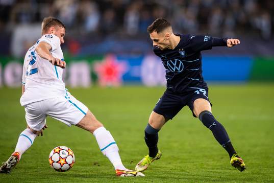 Veljko Birmancevic of Malmö FF and Dmitri Chistyakov of