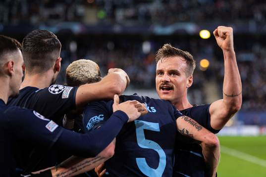 Eric Larsson of Malmö FF celebrate with teammates