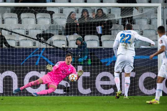 Goalkeeper Johan Dahlin of Malmö FF saves a penalty from