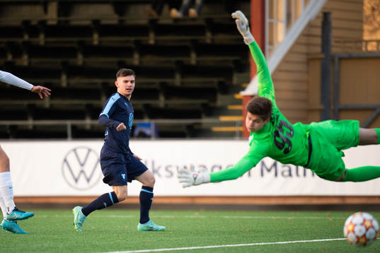 Isak Bjerkebo of Malmö FF and goalkeeper Georgii Korolev